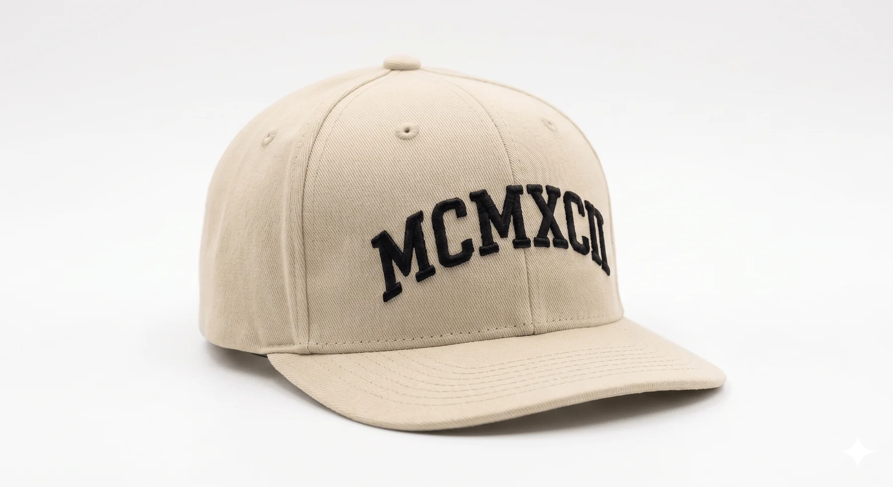 The MCMXCII Signature Cap — front view, MCMXCII embroidery in black on Sand Cream